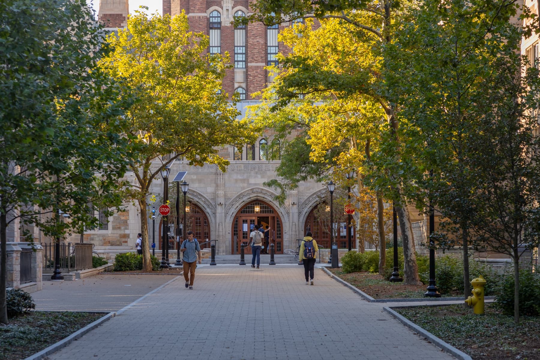 Students walking along Alexander Walk on Yale's campus in New Haven.